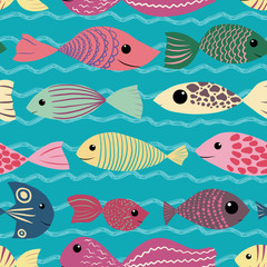 Fototapeta premium Seamless pattern of children cute fish on blue wavy background. Cartoon style multicolored underwater creatures. Smilin animals for kids textile, wrapping paper scrapbooking, postcard, invitations