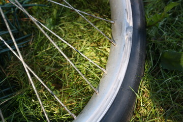 Close up of bicycle wheel on blurred background