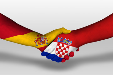 Handshake between croatia and spain flags painted on hands, illustration with clipping path.