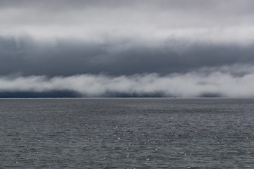 Morning mist layer and clouds over Altlantic ocean on the west coast of Ireland