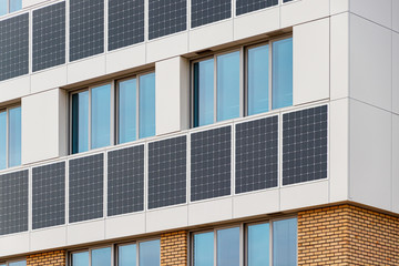 Building solar panels. Solar elementary school building. Eco-friendly school building.