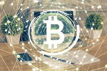 Double exposure of blockchain theme hologram and table with computer background. Concept of bitcoin crypto currency.