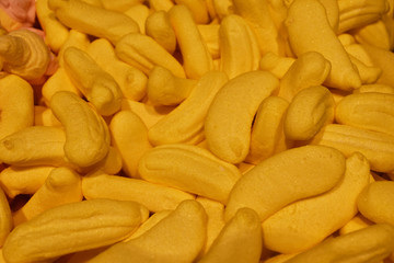 Banana-shaped marmalade. Food texture and background