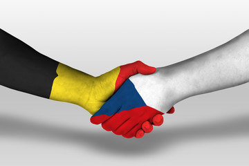 Handshake between czech republic and belgium flags painted on hands, illustration with clipping...