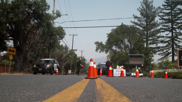 Napa, California, USA. 22 August 2020. Police officers at road closure checkpoint. LNU Lightning Complex Fire LNU Lightning Complex Fire that ravaged the Napa, Sonoma, Lake and Solano counties.