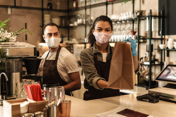 Coffee shop owners with face masks, lockdown