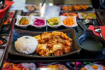 Plate of rice and fried tofu cheese, bowl of soup. Top view. National food, asian dishes concept