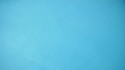 fresh red apples stack themselves in paper bag on wooden background, stop motion animation, time lapse