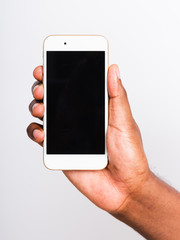 Closeup hand black man holding mockup white modern digital mobile smart phone blank screen on hand,...