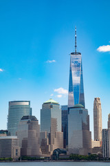 Fototapeta na wymiar Vertical image of the lower Manhattan skyline on a clear blue day. 