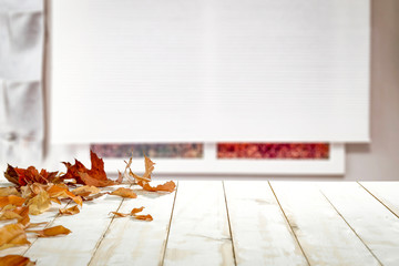 Naklejka na ściany i meble Table background of free space and autumn window 