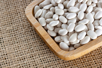 white beans in a wooden plate