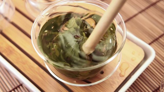 green tea close-up in a glass transparent dish. tea ceremony, tea party