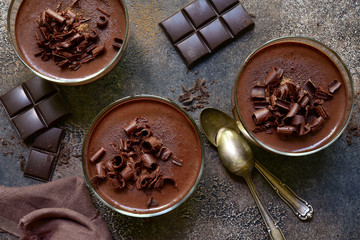 Delicious chocolate mousse in a glasses. Top view with copy space.