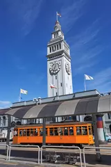 Foto op Canvas 'Ferry building' Port Tower of San Francisco against blue skies in California © allan