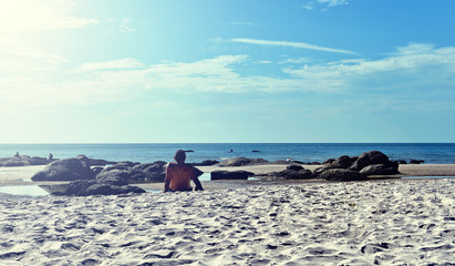 Summer beach vacation concept,  man relaxing on beach, ocean sunny view