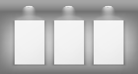Realistic illustration of the gallery wall with lighting and three empty frames.