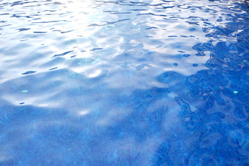Hotel swimming pool with sunny reflections