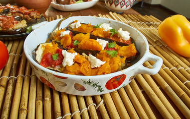 Baked aubergine stuffed with roast pumpkin, feta