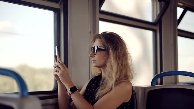 Tourist Active Lifestyle On Vacation Travel Tourism Adventure And Picture.Female Traveler On Train Using Smartphone App For Photo.Woman Tourist Looking On City And Taking Photo On Mobile Phone Camera.