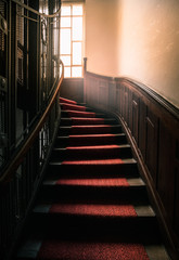 Low angle view old stair with red carpet
