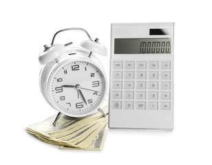 Alarm clock with calculator and money on white background