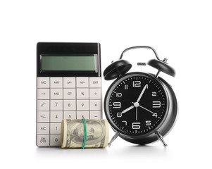Alarm clock with calculator and money on white background