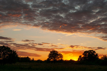 orange sunset over the river. sunset over the river. beautiful warm summer red sunset