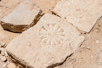 Decorative  stone carvings on walls in ruins of Shivta - a national park in southern Israel, includes the ruins of an ancient Nabatean city in the northern Negev.