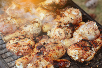 Pork steak grilling on a summer barbecue. BBQ background.
