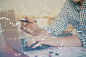 Fototapeta premium Businessman with computer background with technology theme hologram. Concept of big data. Double exposure.