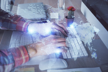 Social network theme hologram with businessman working on computer on background. Concept of world...