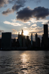 Beautiful Silhouettes of Skyscrapers in the Midtown Manhattan Skyline during a Sunset along the East River in New York City