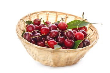 Fototapeta na wymiar Basket with ripe sweet cherry on white background