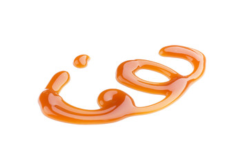 Liquid caramel on white background