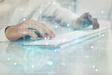 Fototapeta premium Multi exposure of tech drawings with man working on computer background. Concept of innovation.