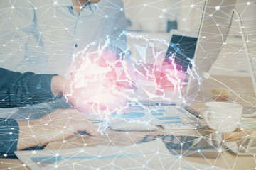 Man with computer background with brain theme hologram. Concept of brainstorm. Double exposure.