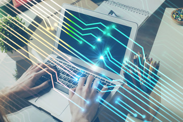 Multi exposure of technology hologram with man working on computer background. Concept of big data.