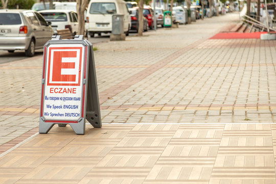 Alanya, Turkey - 23 Aug 2020: Eczane sign with multi lingual translation of word meaning. Sign stating Pharmacy for tourists speaking different languages.