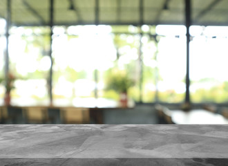 Empty white concrete cement table top and blurred abstract restaurant interior background
