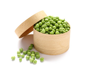 Box with tasty fresh peas on white background