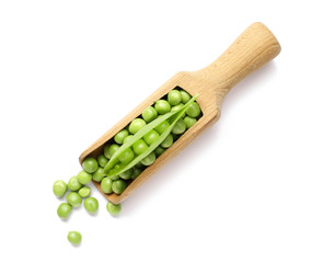 Scoop with tasty fresh peas on white background