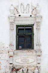 Fototapeta na wymiar Vintage window of old stone church