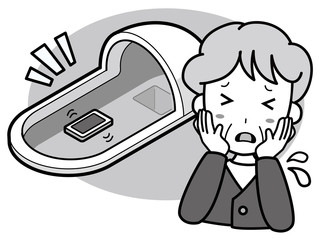和式トイレに携帯電話を落として困っているおばあさん