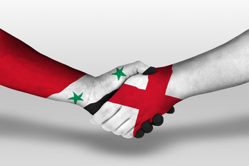 Handshake between england and syria flags painted on hands, illustration with clipping path.