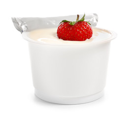 Plastic cup of strawberry yogurt on white background