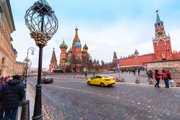 Moscow, Russia - Dec 29, 2019: New year in the Russian capital. Christmas in Moscow. Red square. Moscow Kremlin. Yellow taxi.