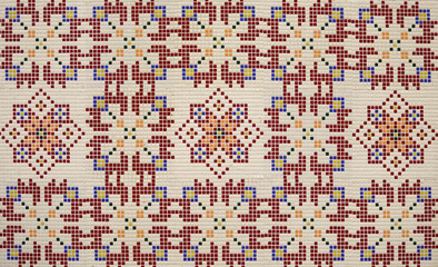 Fototapeta premium Checkered traditional Bulgarian ceramic mosaic tile background pattern. Architectural mosaic detail, abstract background for street, bath and pool. Ornamental pattern for street and interior design