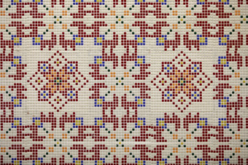 Fototapeta premium Checkered traditional Bulgarian ceramic mosaic tile background pattern. Architectural mosaic detail, abstract background for street, bath and pool. Ornamental pattern for street and interior design