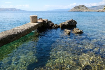 Idyllic view of rocky coast of Adriatic sea with amazing crystal clear water in Sveti Juraj,...